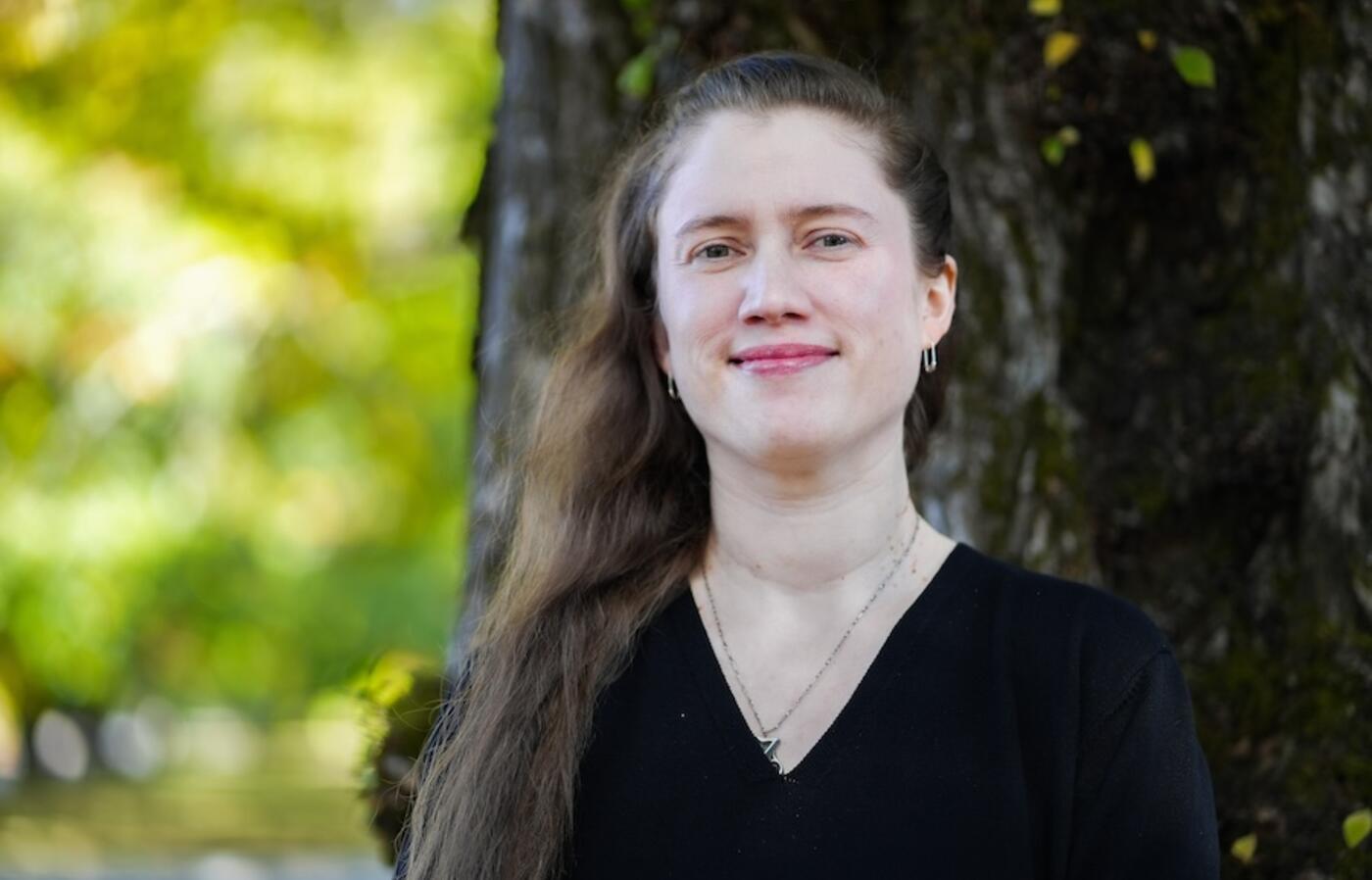 a person standing in front of a tree