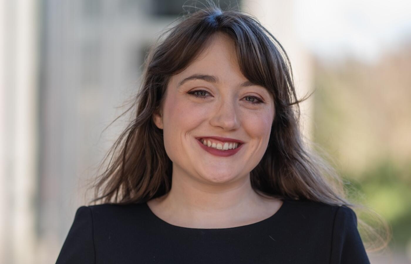 woman in black shirt smiling