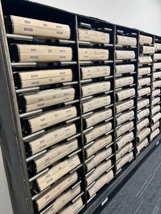 a cabinet full of paper binders