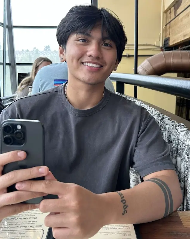 person taking a selfie at a restaurant