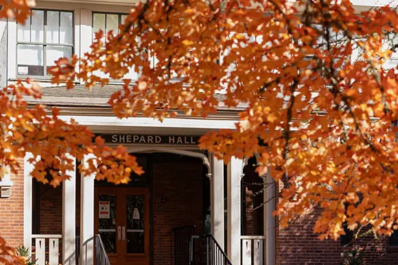 shepard hall with autumn leaves