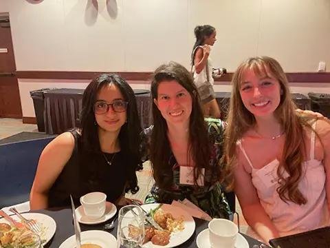 Jahnavi Nanwani, Dr. Cservenka, and Megan Campbell at the College of Liberal Arts Outstanding Seniors Luncheon