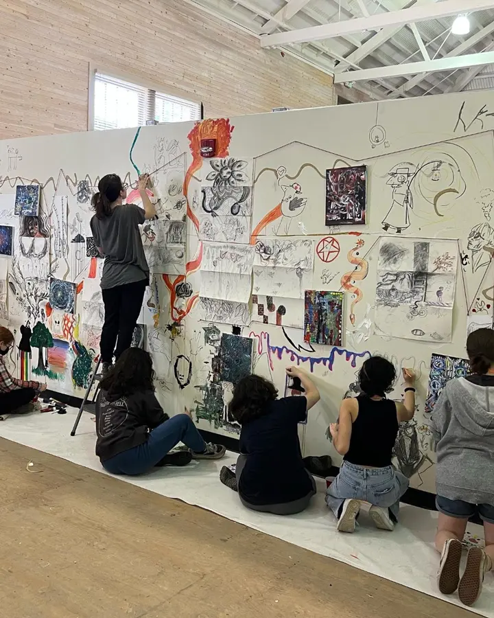 students painting a mural