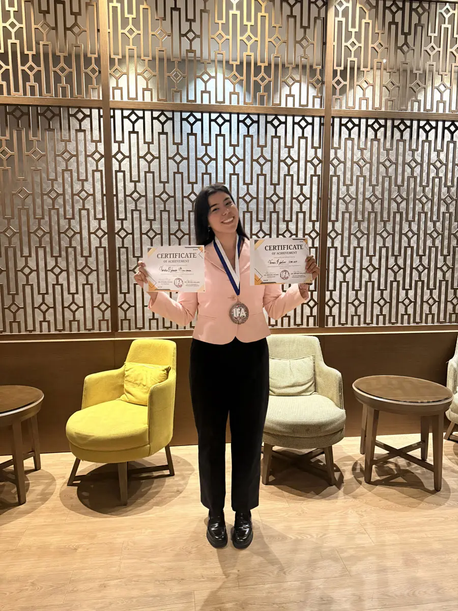 Veronica celebrating her success outside of the awards ceremony in Athens, Greece.