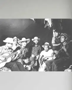 Migrant farm Workers Playing Guitar and Singing