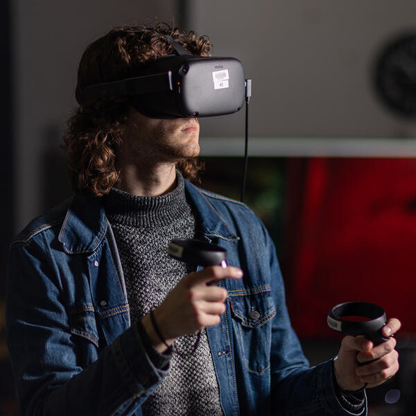 New Media Communications student using virtual reality equipment