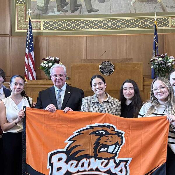 students with beaver banner at courthouse