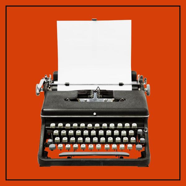 typewriter with white paper sticking out above against orange background with black border