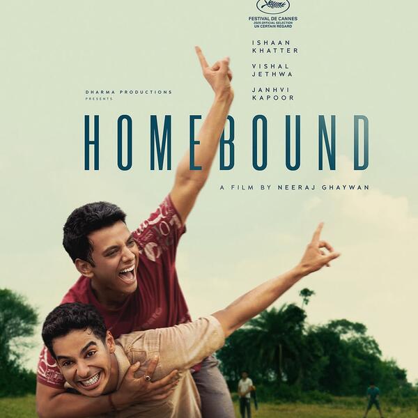 Movie poster showing two Indian men, one on the other's back, outdoors, both smiling and holding up their pointer finger