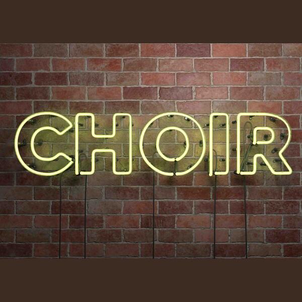 Brick wall with neon letters for "choir"